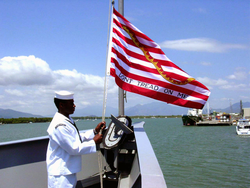 US_Navy_020911-N-0000H-001_Raising_the_Navy_Jack_aboard_ship.jpg